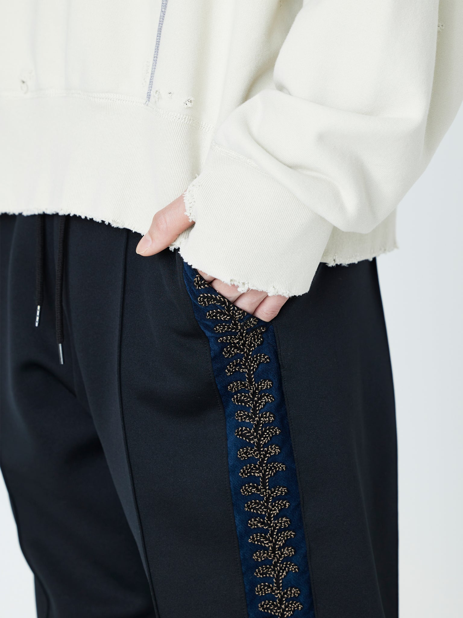 EMBROIDERED TRACK PANTS<br />[BLACK]