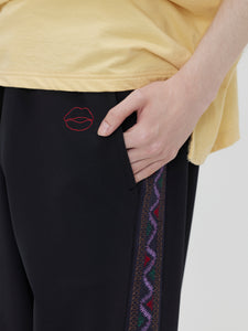 EMBROIDERED TRACK PANTS[BLACK]